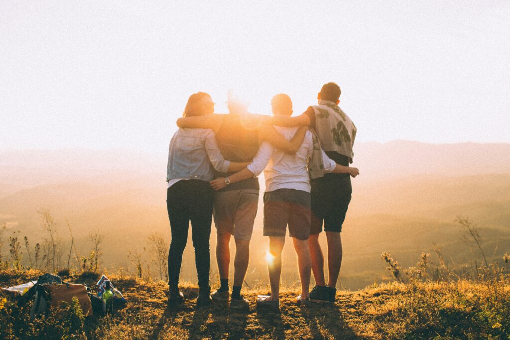 is hiking inclusive featured image of 4 hikers hugging eachother